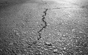 Texas asphalt crack repair cracked pavement with water infiltration