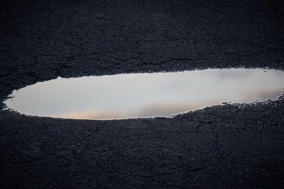 water pooling on asphalt water pooling on asphalt