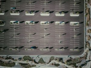 well-maintained commercial asphalt parking lot with clear stripes